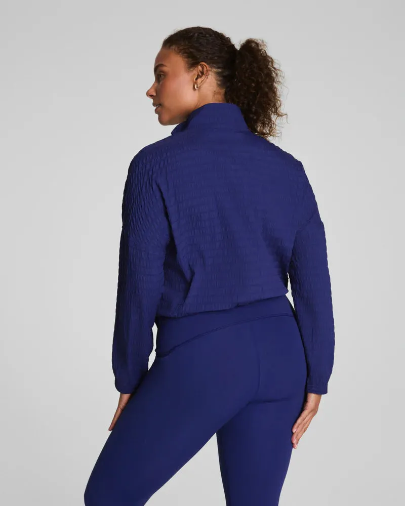 PocketDetails SPANX Get Moving Textured Half Zip in Midnight Iris